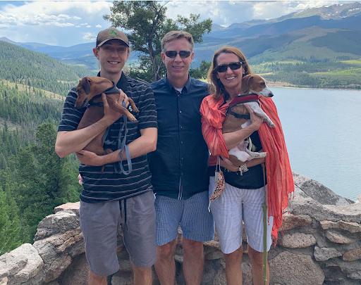 Ms. Amy with her son and husband in the mountains