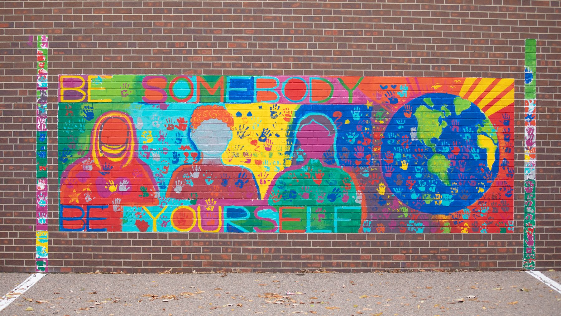Mural painted on school wall, Be Somebody Be Yourself