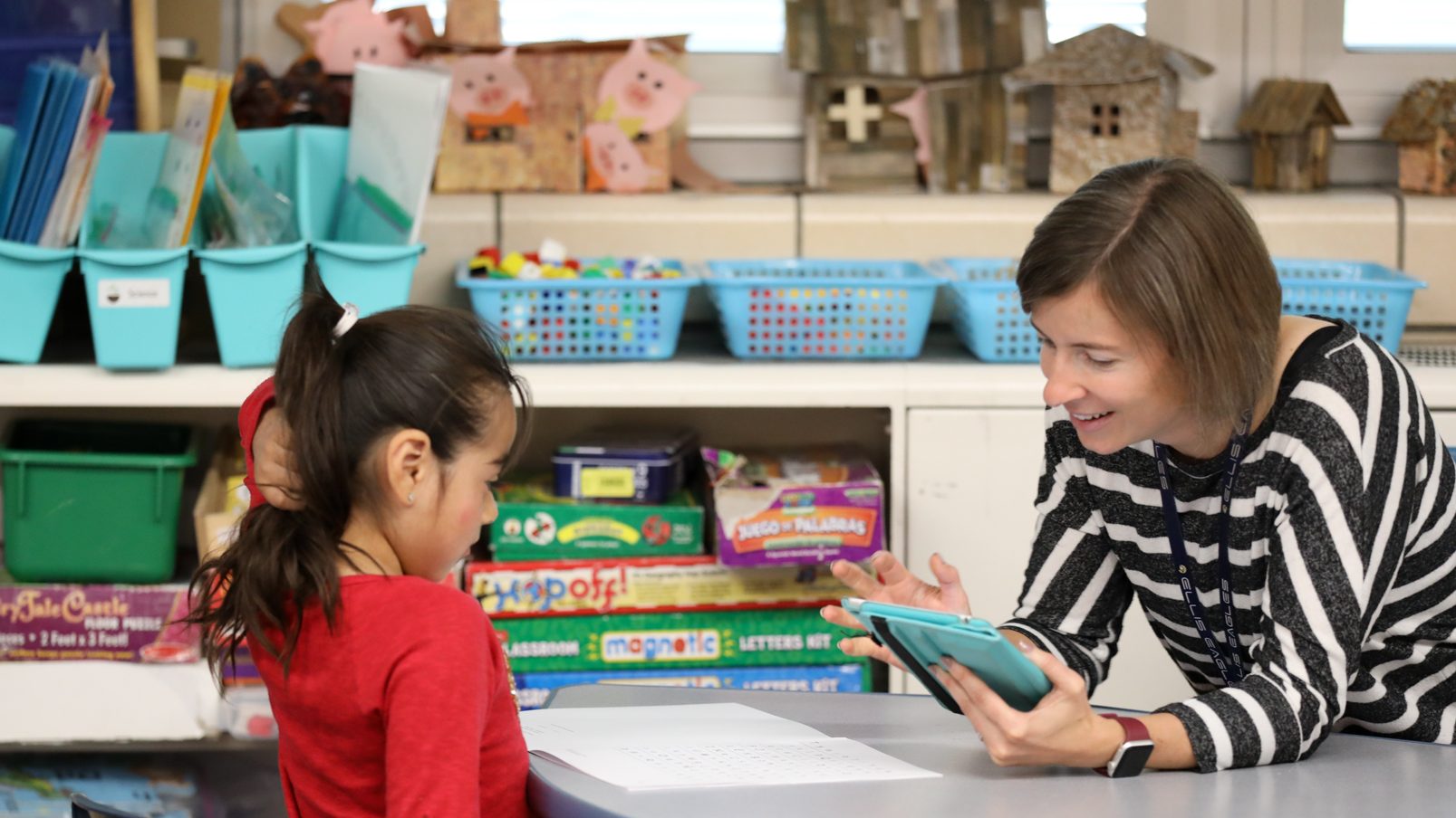 Teacher working with student