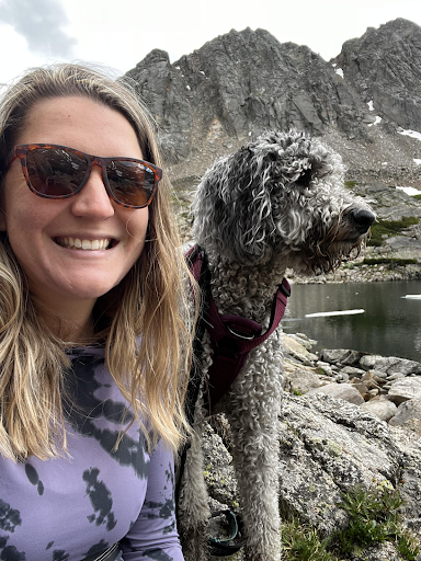 Ms. Rad with her dog in the mountains